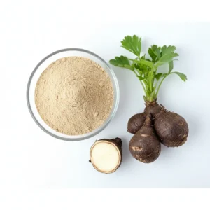 black maca powder in a dish beside fresh maca root plant.